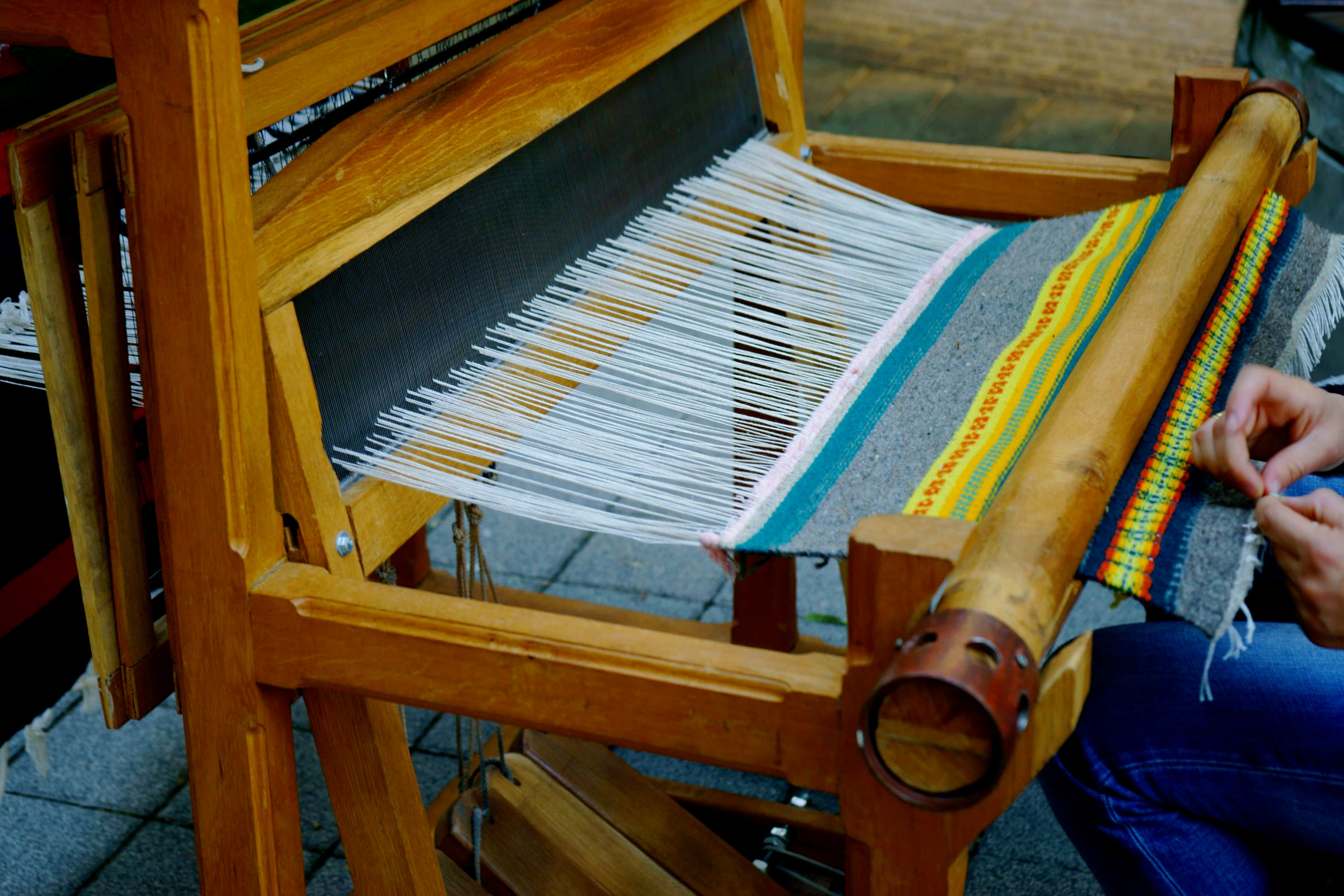 Weaving textiles on the loom